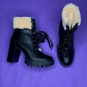 Black leather boots with white soft fur